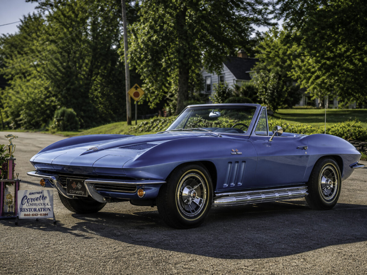Enhanced original photo of a blue classic Chevrolet Corvette convertible displayed outdoors by Corvette Connection in Bolton, Connecticut.