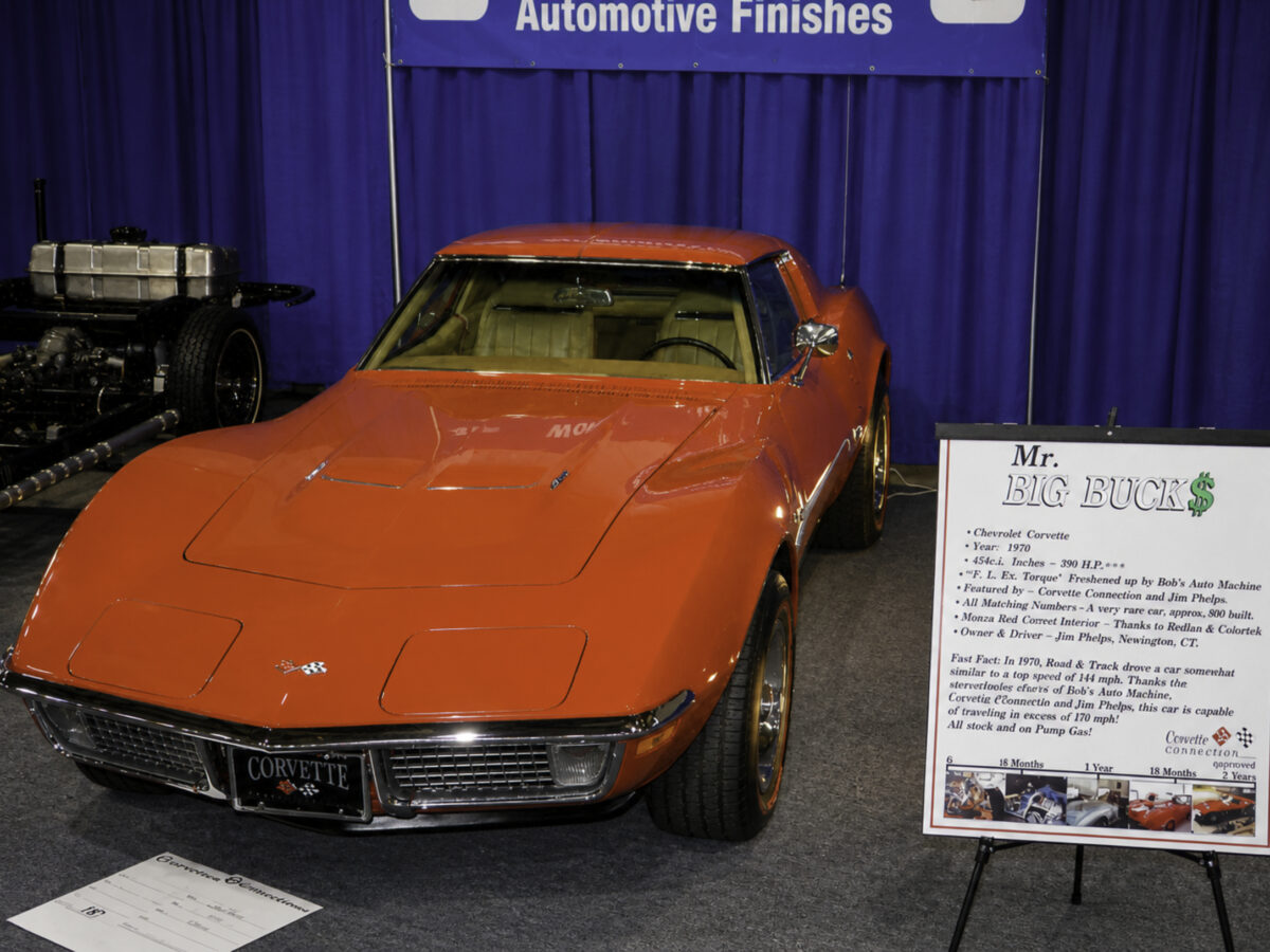 Enhanced original photo of a red Chevrolet Corvette displayed at an automotive show after restoration by Corvette Connection in Bolton, Connecticut.