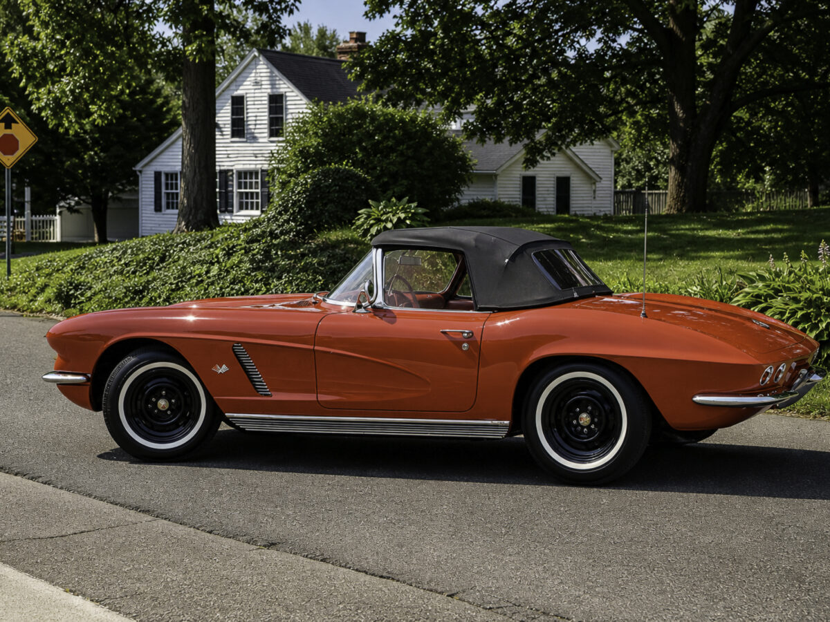 AI-remastered red classic Chevrolet Corvette convertible side view photographed outdoors by Corvette Connection in Bolton, Connecticut.