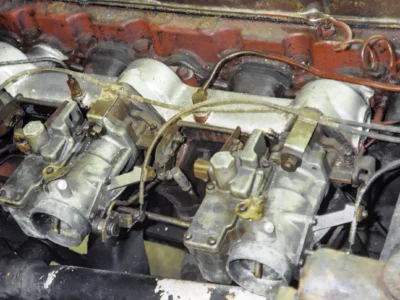 1954 Corvette engine bay close-up showing original components before rebuild