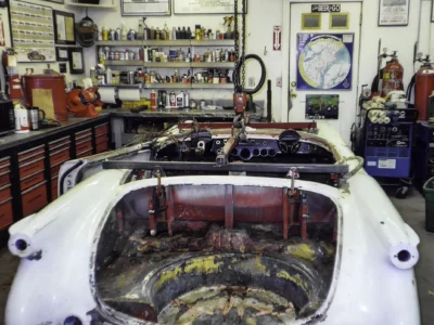 1954 Corvette engine bay area showing wiring and components before restoration
