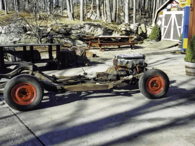 1954 Corvette bare frame and rolling chassis outdoors at Corvette Connection in Bolton CT