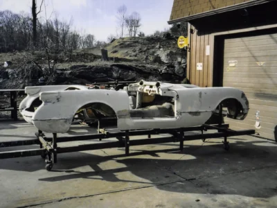 1954 Corvette bare fiberglass body on rotisserie showing structure at Corvette Connection
