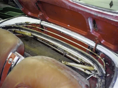 1954 Corvette frame on jack stands with engine removed during restoration at Corvette Connection