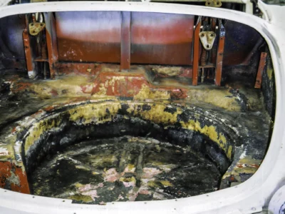 1954 Corvette inner wheel well showing fiberglass layup and repair work