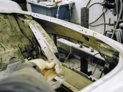 1954 Corvette windshield frame and cowl area during fiberglass body restoration at Corvette Connection
