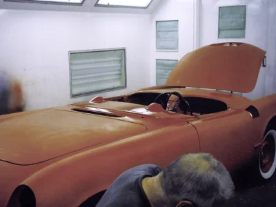 1954 Corvette in primer being driven outdoors to settle panels at Corvette Connection in Bolton CT