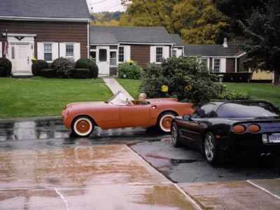 Completed 1954 Corvette in red side profile outdoors at Corvette Connection in Bolton CT