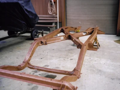 1954 Corvette frame in red primer during frame restoration at Corvette Connection