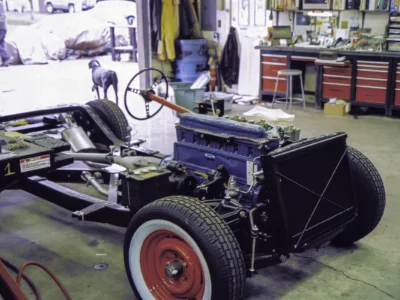 1954 Corvette rolling chassis with Blue Flame engine in shop at Corvette Connection