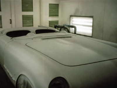 1954 Corvette body in white final paint in paint booth at Corvette Connection