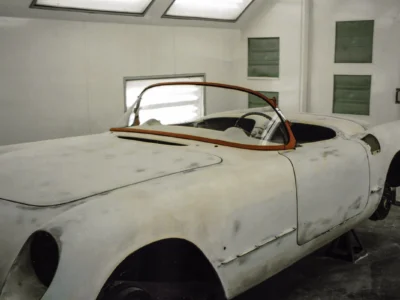 1954 Corvette body in white paint with windshield frame and convertible top frame installed