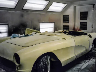 1957 Corvette body in primer outdoors showing restored body lines at Corvette Connection in Bolton CT