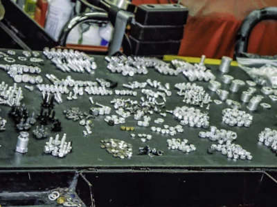 Restoration hardware and fasteners laid out and labeled for 1957 Corvette frame-off at Corvette Connection