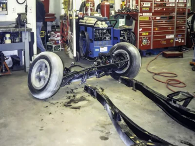 "1957 Corvette rolling chassis with front suspension and wheels assembled at Corvette Connection