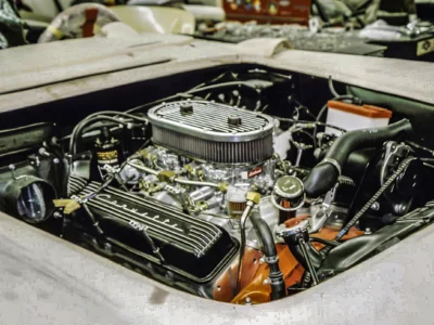 Restored fuel injection engine with chrome valve covers in 1957 Corvette engine bay