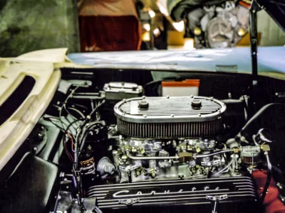 Fuel injection engine bay with chrome air cleaner on 1957 Corvette during assembly at Corvette Connection