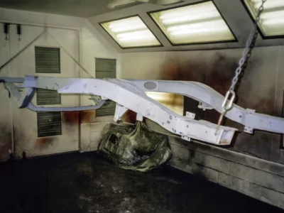 1957 Corvette front fenders and nose section in paint booth at Corvette Connection