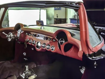 Restored red interior and chrome dashboard on 1957 Corvette at Corvette Connection