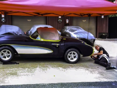 1957 Corvette in black with convertible top being fitted at Corvette Connection
