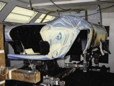 1965 Corvette Sting Ray front end masked for paint showing engine bay at Corvette Connection