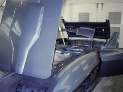 1965 Corvette Sting Ray hood detail showing blue paint and body line at Corvette Connection