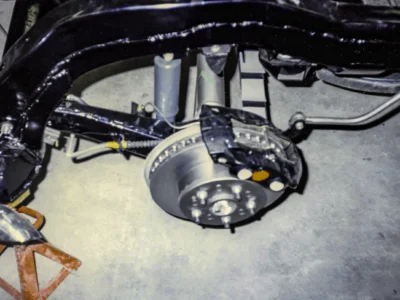 1965 Corvette restored front brake assembly and suspension close-up at Corvette Connection