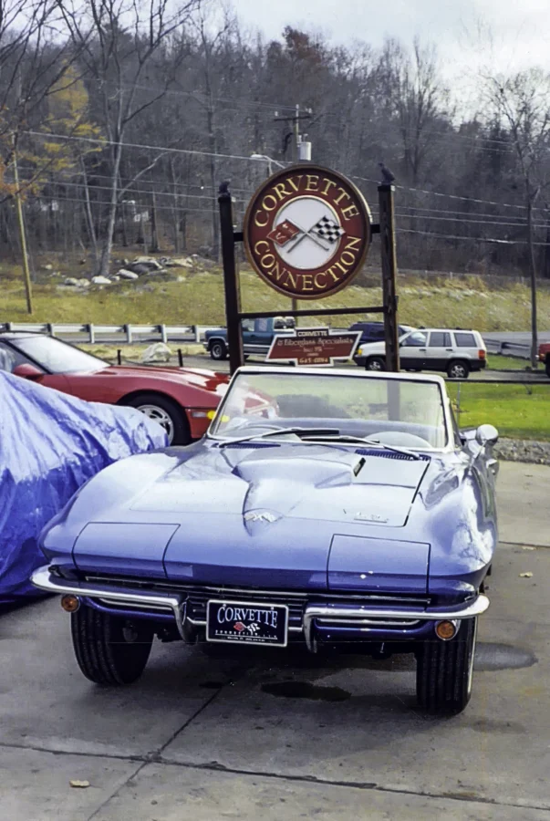 1966 Corvette Sting Ray in Nassau Blue arriving at Corvette Connection with Corvette Connection sign visible