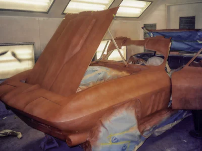 Saddle tan interior being installed in 1966 Corvette Sting Ray during restoration