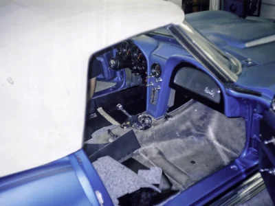 1966 Corvette Sting Ray cockpit in Nassau Blue showing dashboard and gauges during assembly