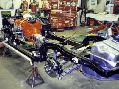 1966 Corvette rolling chassis with red engine and drivetrain assembled at Corvette Connection