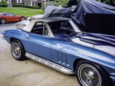 Restored 1966 Corvette Sting Ray convertible in Nassau Blue side profile at car show
