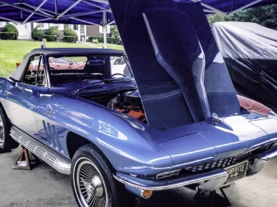 1966 Corvette Sting Ray in Nassau Blue front three-quarter with hood up at car show