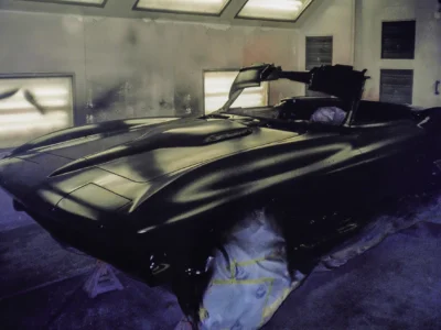 1966 Corvette Sting Ray rear deck in fresh black paint in paint booth at Corvette Connection