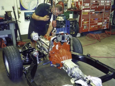 Technician working on 1968 Corvette drivetrain installation at Corvette Connection in Bolton, CT