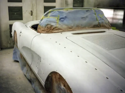 Side profile of 1958 Corvette body in primer ready for color application at Corvette Connection