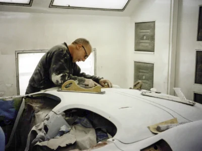 Corvette Connection technician working on 1958 Corvette body shell during bodywork stage
