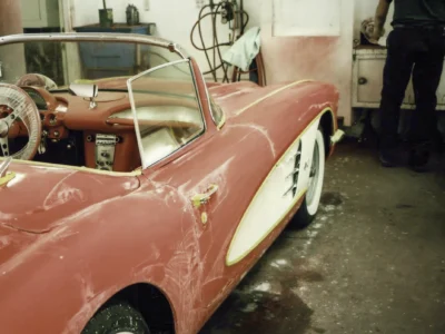 Rear three-quarter of finished red and white 1958 Corvette outdoors at Corvette Connection