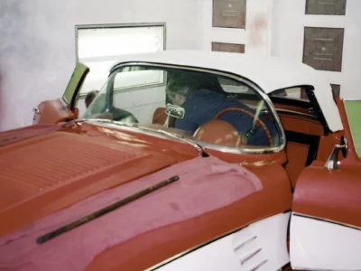 Side profile of red and white 1958 Corvette interior during reassembly at Corvette Connection