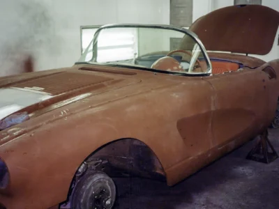 Side profile of 1958 Corvette body in red primer ready for color coat application