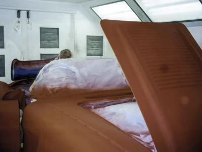 Hood and trunk panels of 1958 Corvette laid out with masking during paint stage