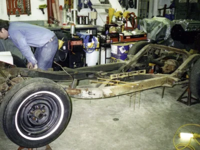 Bare 1962 Corvette frame on stands stripped of body and components at Corvette Connection