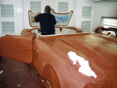 Rear view of 1962 Corvette body shell on stands during body-off teardown