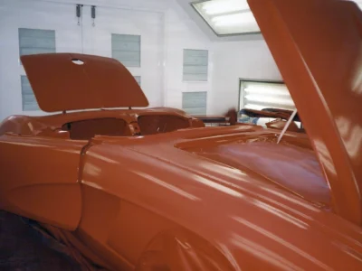 Rear view of 1962 Corvette body shell on stands during body-off teardown