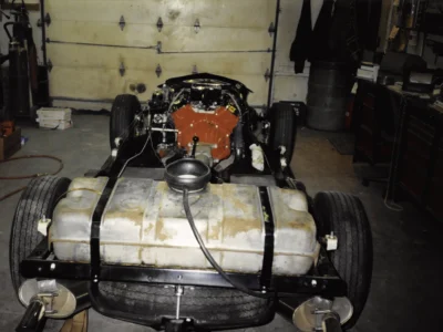 1968 Corvette rear end showing fuel tank and exhaust during assembly