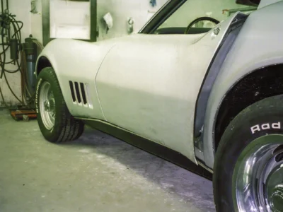 Side view of 1968 Corvette front fender and door area in primer