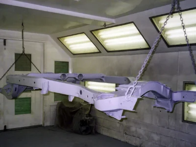 Corvette frame or body component in primer inside the paint booth.