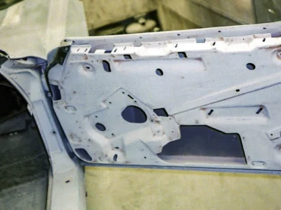 1968 Corvette door shell stripped and painted light blue during restoration.