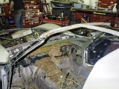 Close-up of stripped 1968 Corvette interior and dashboard area during restoration.