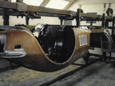 1969 Corvette inner fender well showing fiberglass repair and body filler during restoration